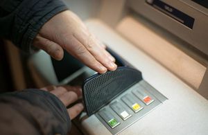 man using an ATM